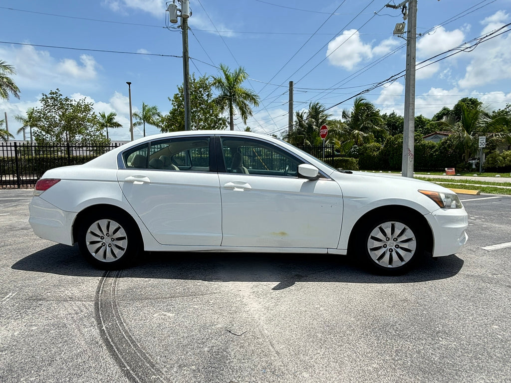 2012 Honda Accord LX – side profile view white rental sedan Florida