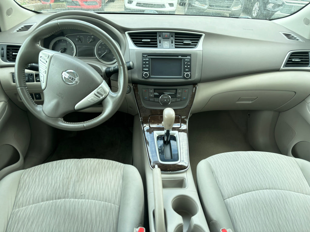 2014 Nissan Sentra S interior – dashboard and steering wheel for rental