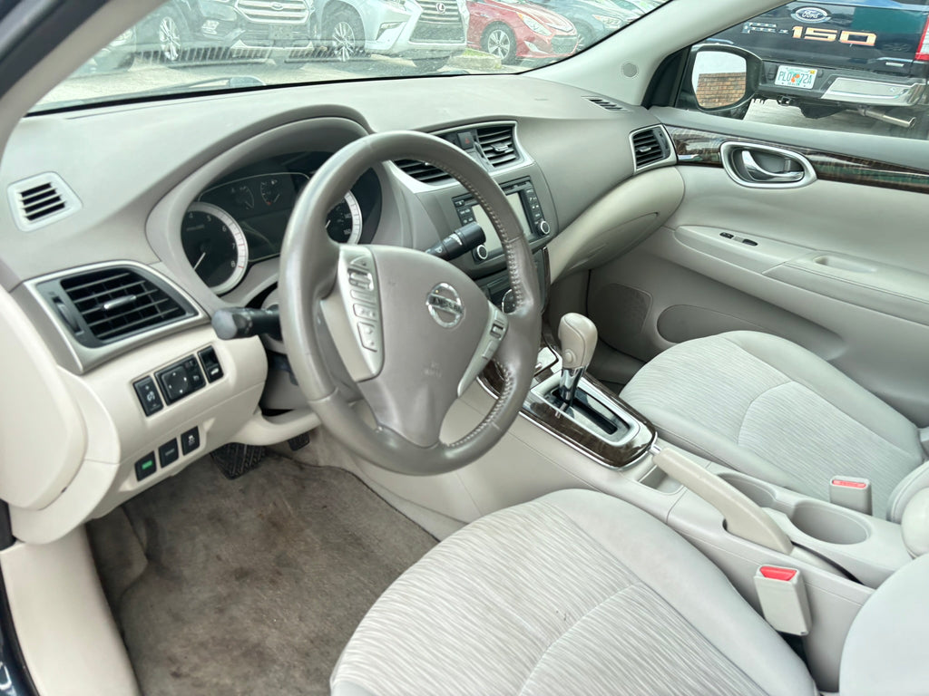 2014 Nissan Sentra S interior – front seats, clean rental car Florida