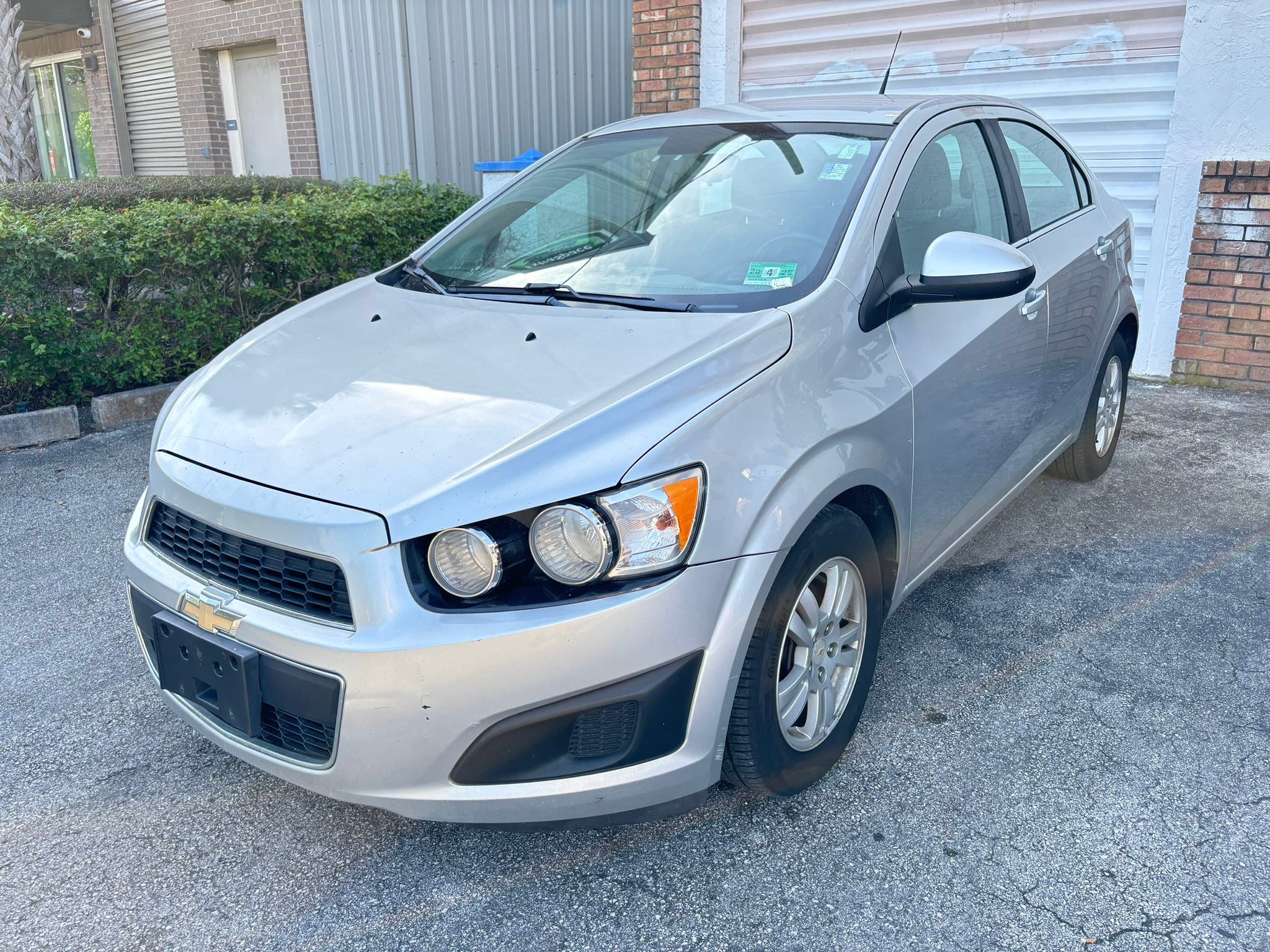 2012 Chevrolet Sonic LT rental car – front left angle view in Fort Lauderdale