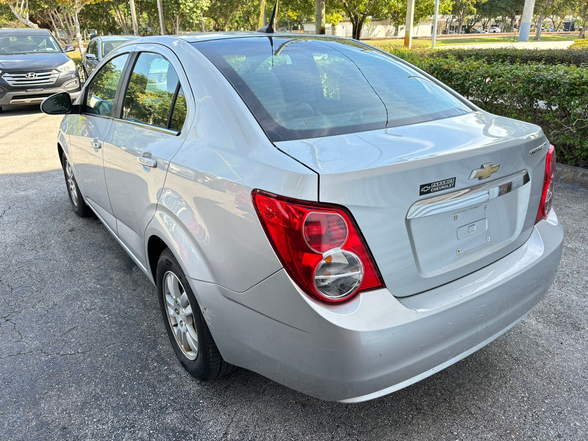 2012 Chevrolet Sonic LT – rear left angle rental car in Florida