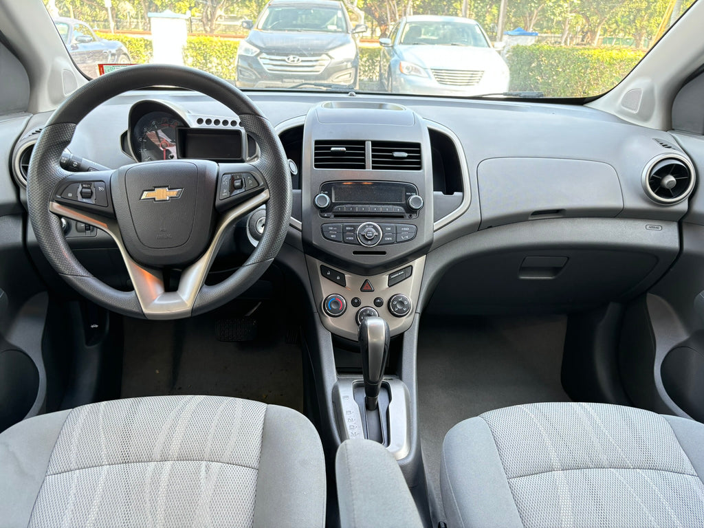 2012 Chevrolet Sonic LT interior – dashboard and steering wheel for rental
