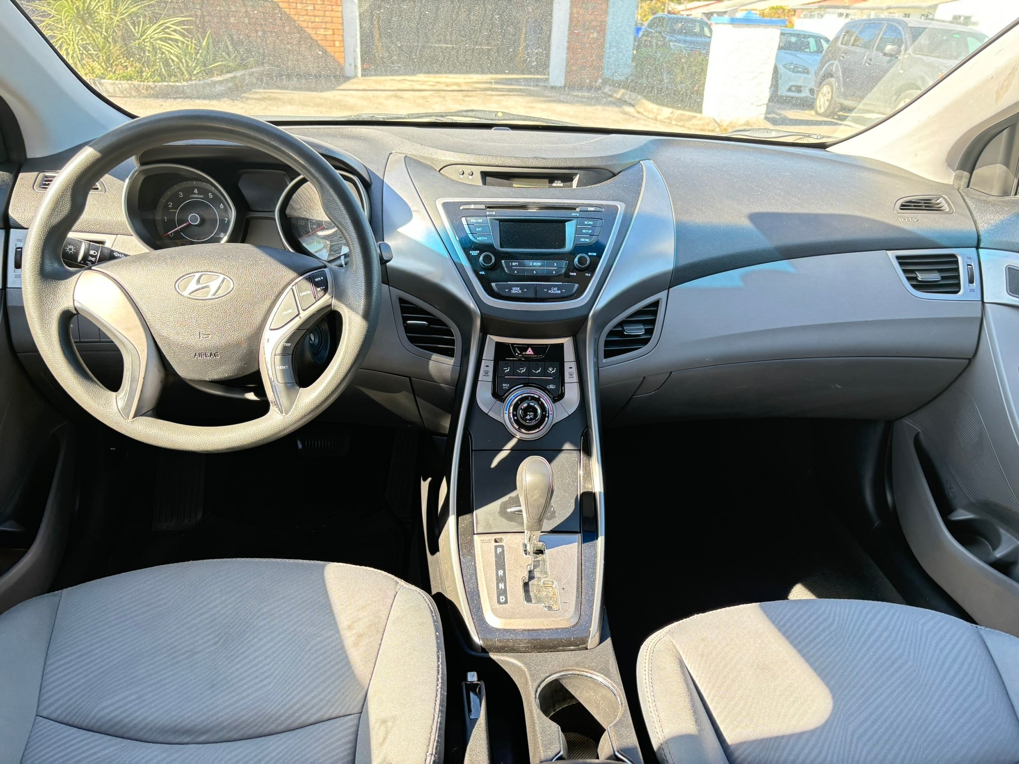 2013 Hyundai Elantra GLS interior – dashboard and steering wheel for rental