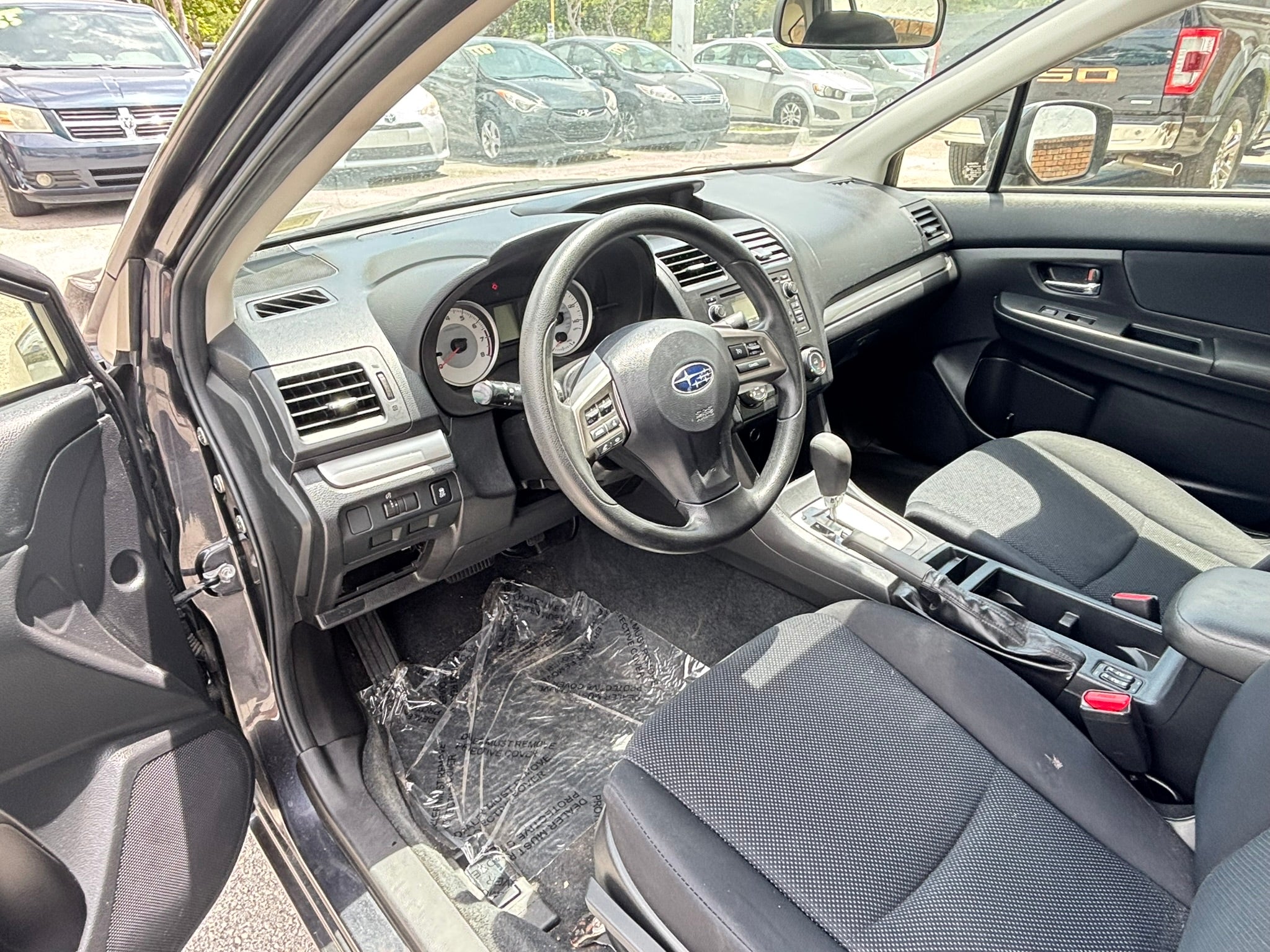 2014 Subaru Impreza 2.0i Premium interior – front seats, clean rental car Florida