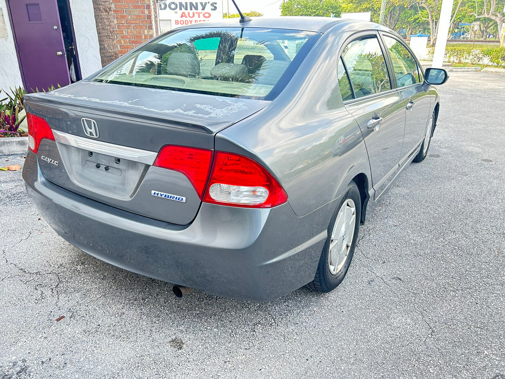 2011 Honda Civic Hybrid – rear right angle fuel-efficient rental vehicle
