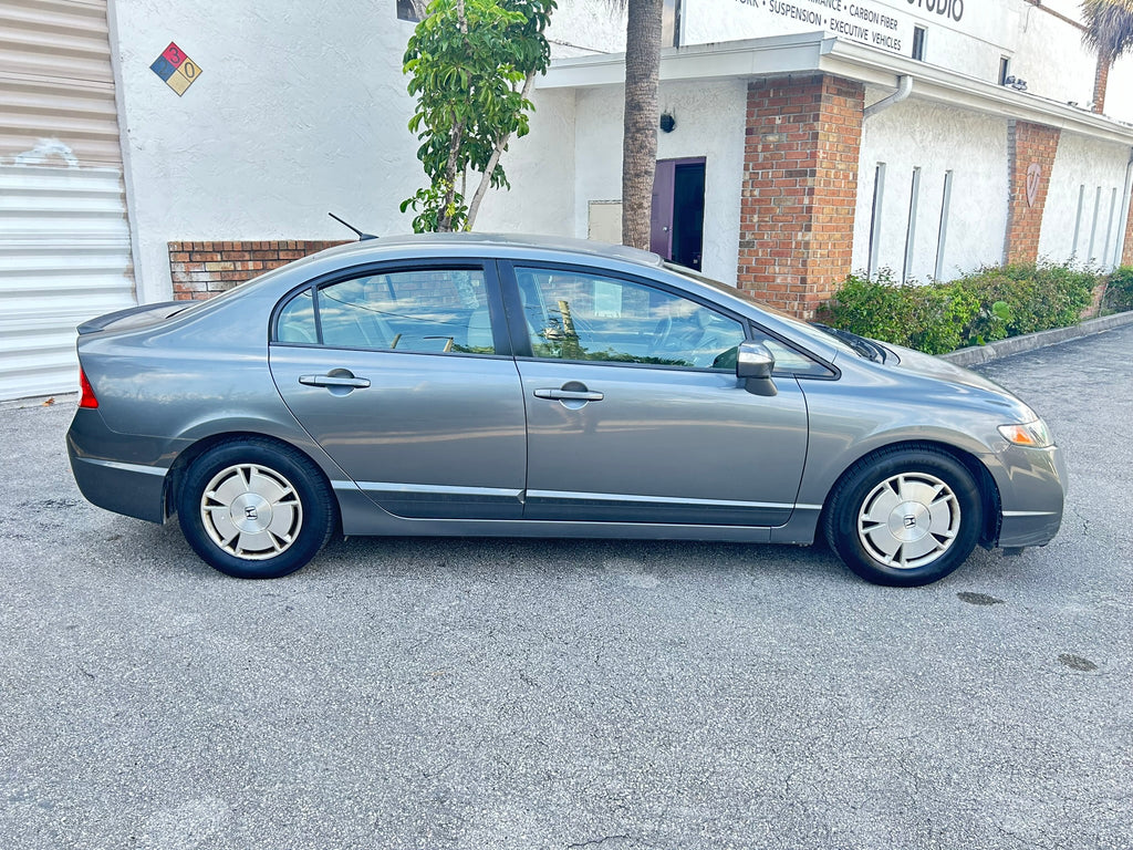 2011 Honda Civic Hybrid – side view, economical rental car Florida