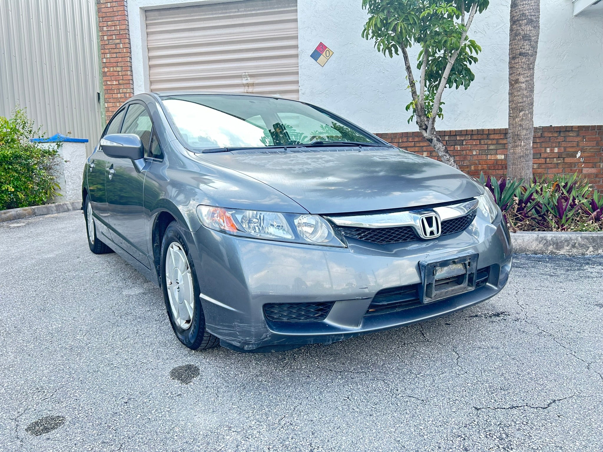 2011 Honda Civic Hybrid – front view, clean fuel-efficient rental car Florida