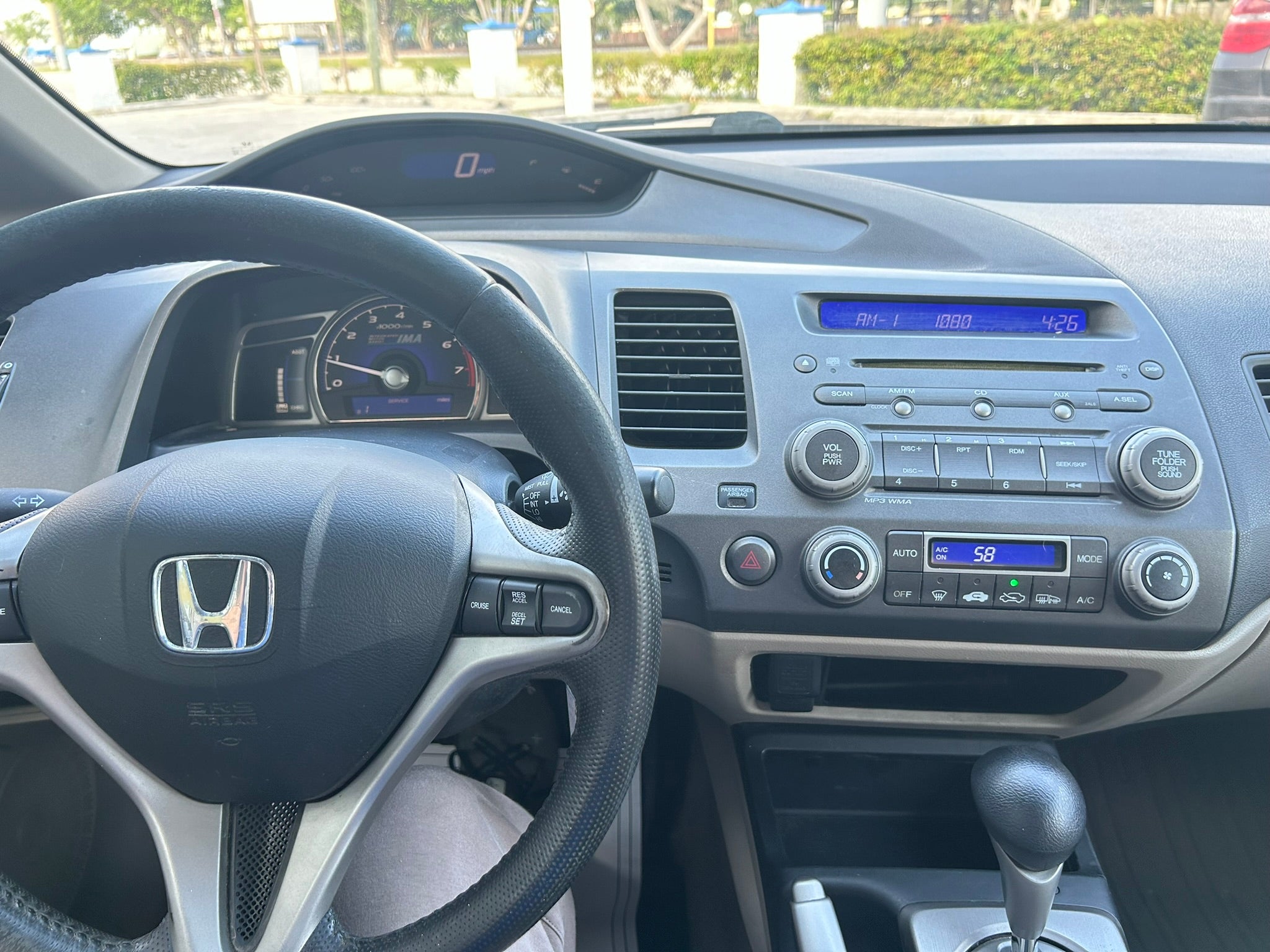 2011 Honda Civic Hybrid interior – dashboard and steering wheel for rental