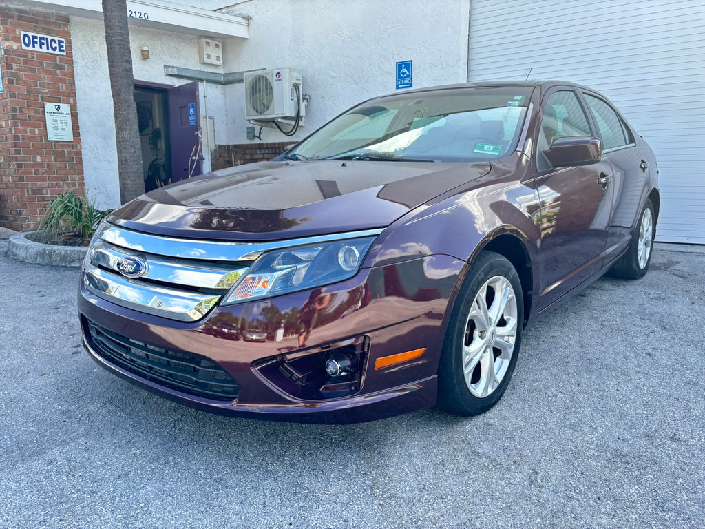 2012 Ford Fusion SE rental car – front angle view in Fort Lauderdale