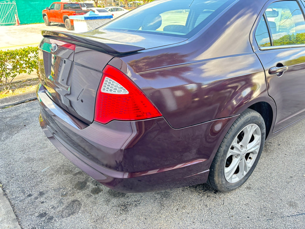 2012 Ford Fusion SE – rear right angle view, affordable rental car Florida