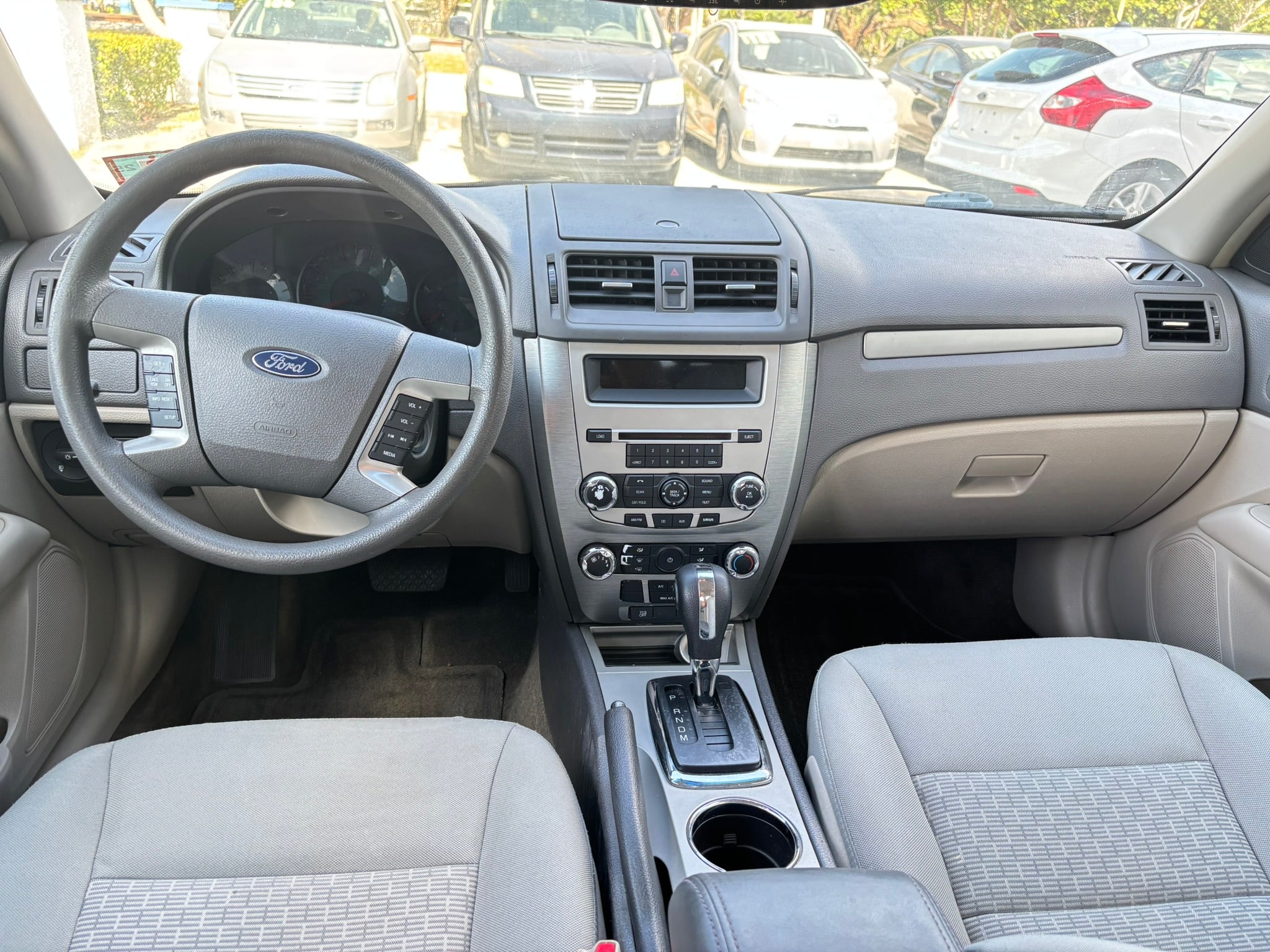 2012 Ford Fusion SE interior – dashboard and steering wheel for rental