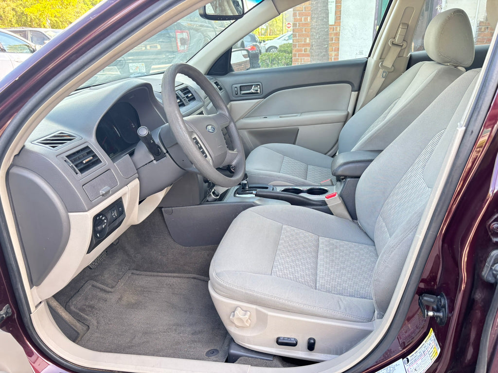 2012 Ford Fusion SE interior – front seats, clean rental car Florida